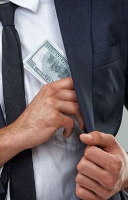 Businessman pockets cash